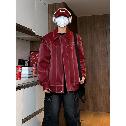 Person wearing a red jacket and headphones in an indoor setting
