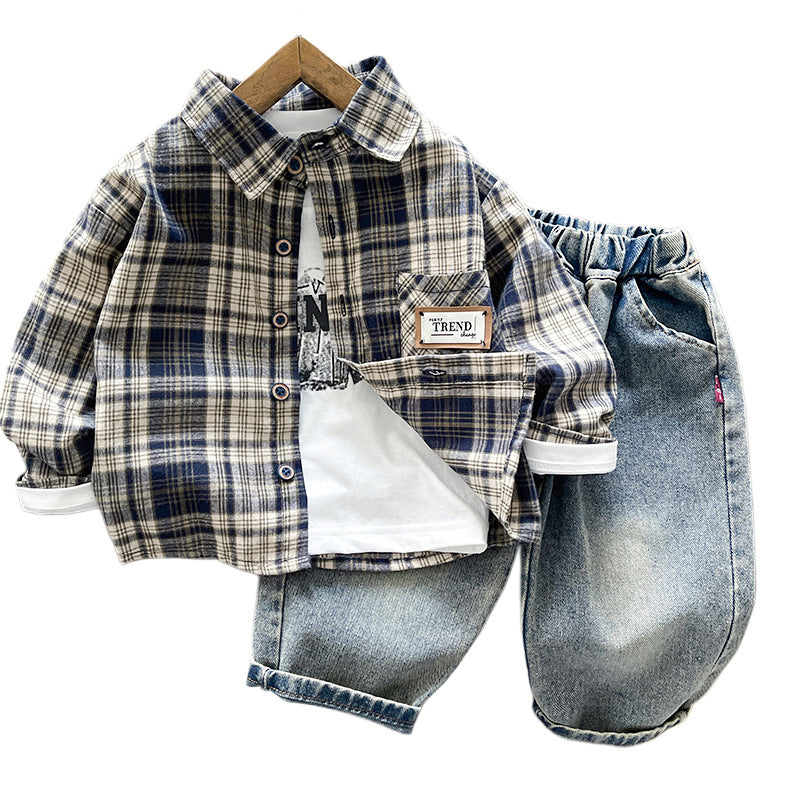 Children's outfit with plaid shirt and denim pants on a white background