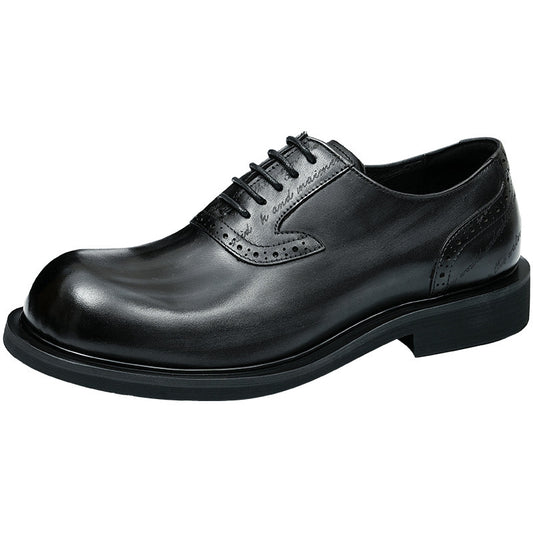Black leather dress shoe on a white background