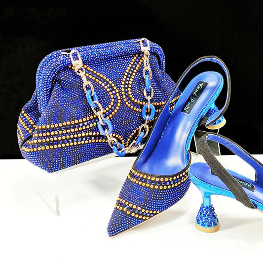 Blue studded high-heeled shoes and matching handbag on a white surface with a black background