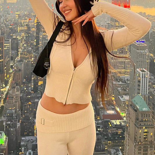 Woman in a beige outfit posing with a cityscape background by millivan