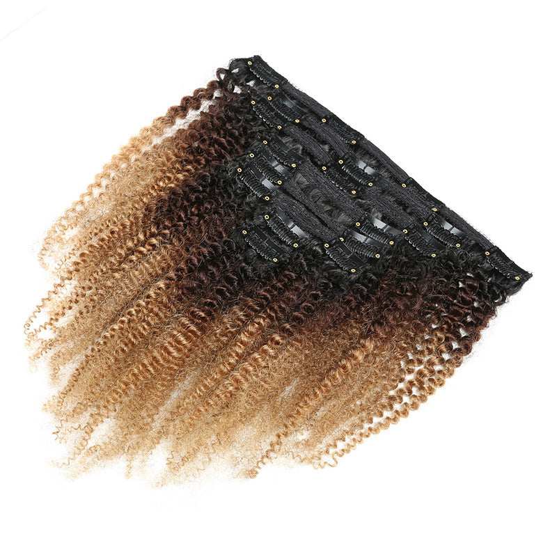 Hair extensions with a gradient from black to blonde on a white background