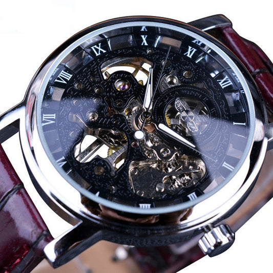 Close-up of a mechanical watch with a red strap on a white background