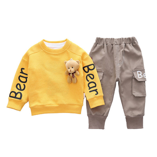 Yellow sweatshirt with 'Bear' text and gray pants on a white background
