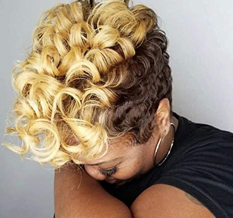 Person with a styled hairdo featuring blonde and brown colors against a plain background