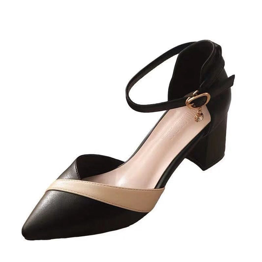 Black and beige high-heeled shoe with ankle strap on a white background