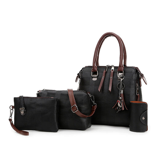 Set of black handbags with brown handles and accents on a white background