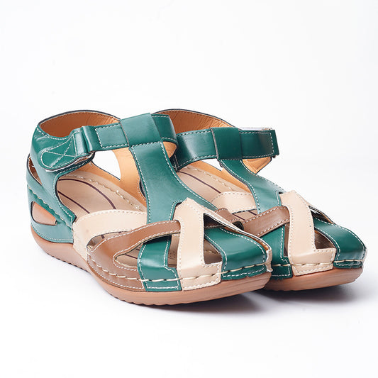 Green and beige sandals on a white background