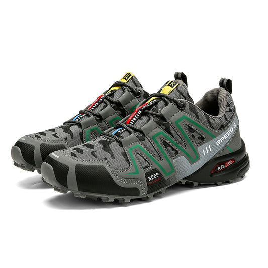 Gray and black athletic shoes with branding on a white background