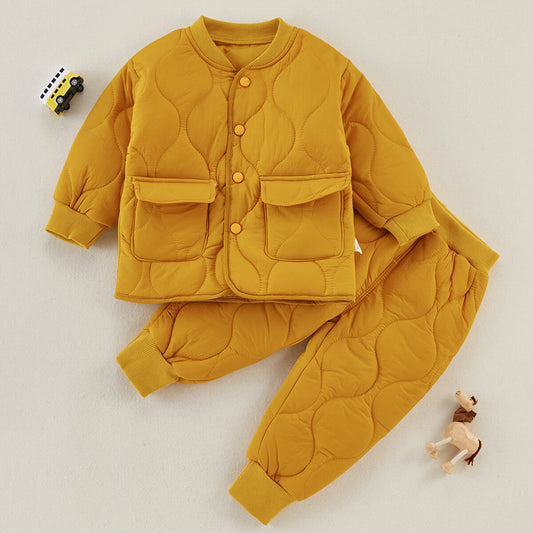 Yellow quilted jacket and pants set on a white background
