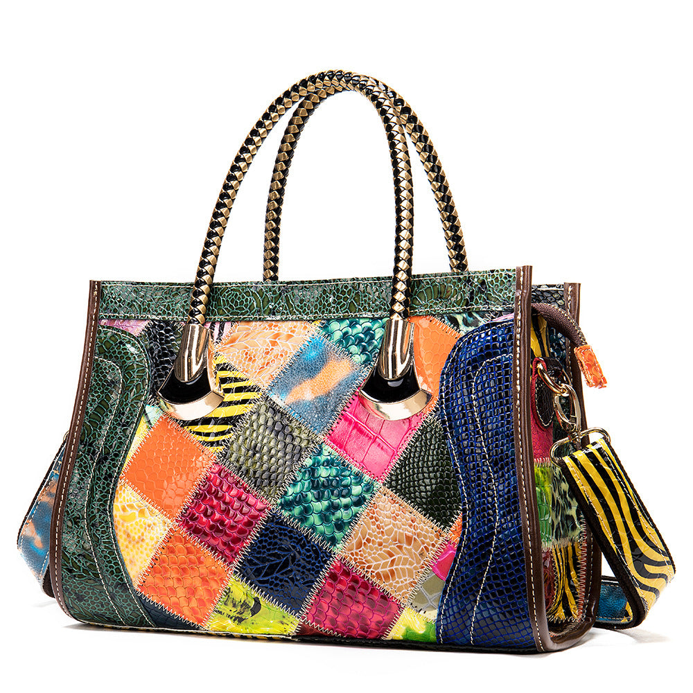 Multicolored patchwork handbag with a keychain on a white background