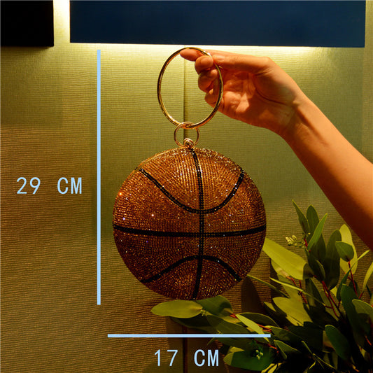 Basketball-shaped handbag with measurements against a gold wall