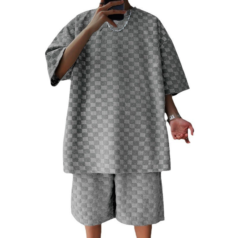 Gray checkered outfit with a shirt and shorts on a white background