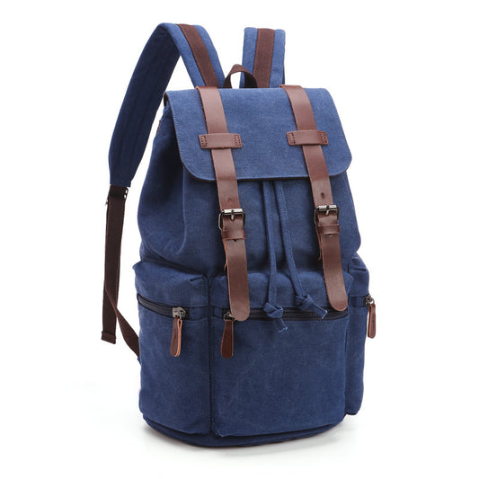 Blue backpack with brown straps on a white background