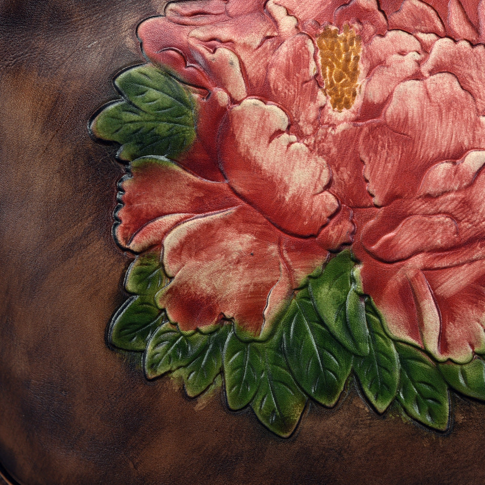 Close-up of a pink floral design on a wooden surface