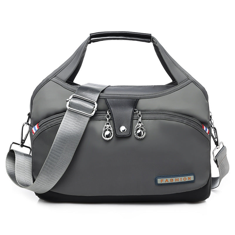 Gray shoulder bag with a strap on a white background