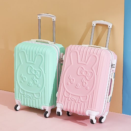 Two cartoon-themed suitcases, one green and one pink, on a colorful background.