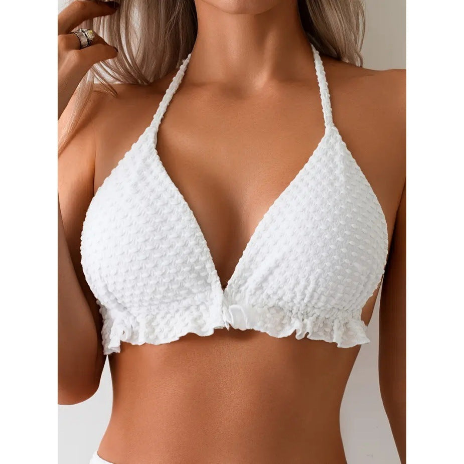 White textured bikini top worn by a model on a neutral background