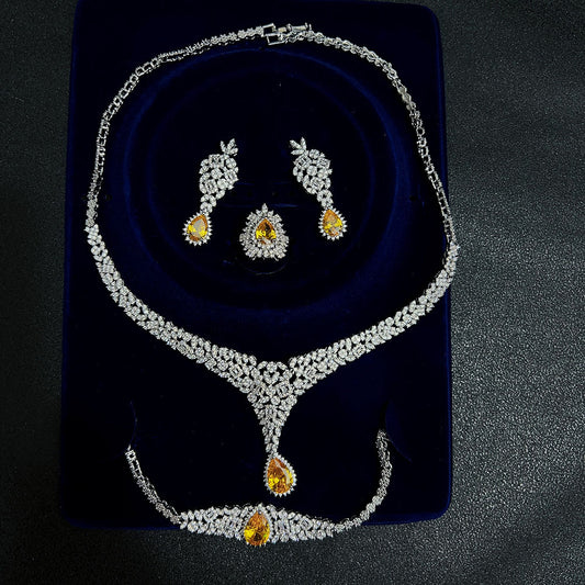Jewelry set with necklace and earrings on a dark background