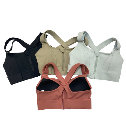 Four sports bras in black, beige, and two shades of pink on a white background