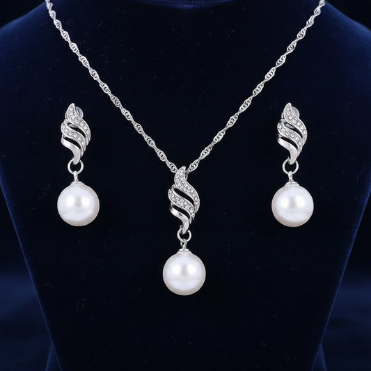 Pearl jewelry set with necklace and earrings on a white background
