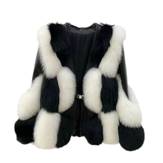 Black leather vest with white fur trim on a white background