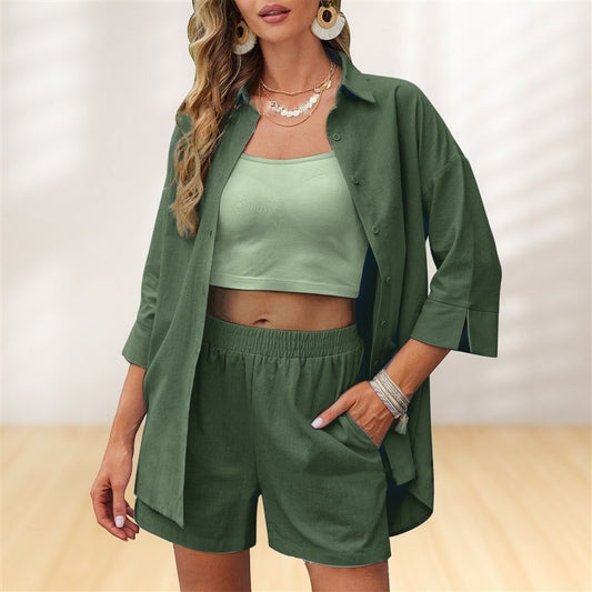 Woman wearing a green outfit with a shirt, top, and shorts on a neutral background