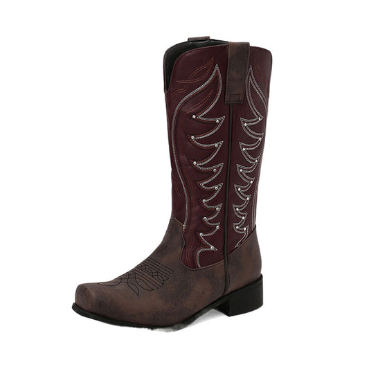 Brown cowboy boot with decorative patterns on a white background