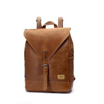 Brown leather backpack on a white background