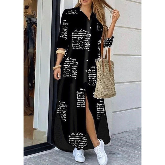 Woman wearing a long black dress with white text pattern, holding a straw bag.
