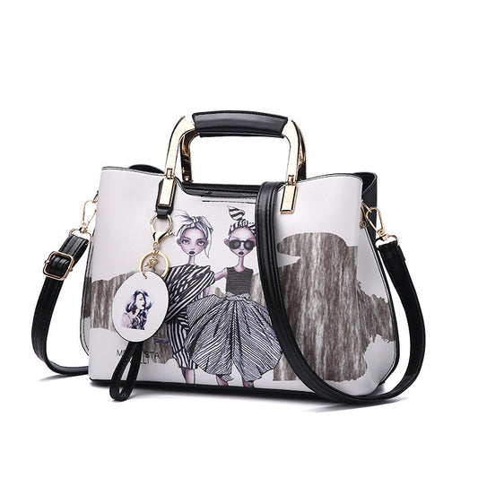 Handbag with artistic design and a keychain on a white background