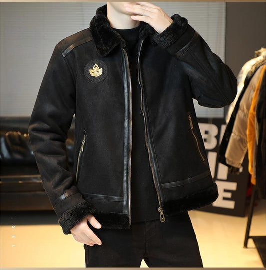 Black jacket with fur lining worn by a person, with a blurred background of a store setting.