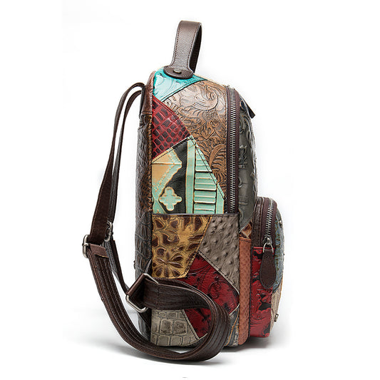 Multicolored patchwork backpack with a brown strap on a white background