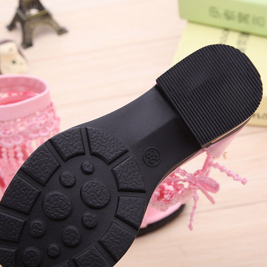 Close-up of a black rubber sole with textural pattern on a blurred background