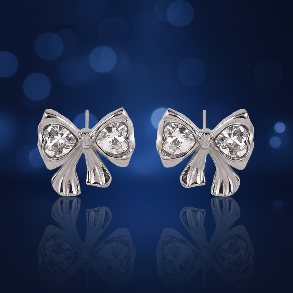 Bow-shaped earrings with zircon stones, shown with measurements and weight on a white background.
