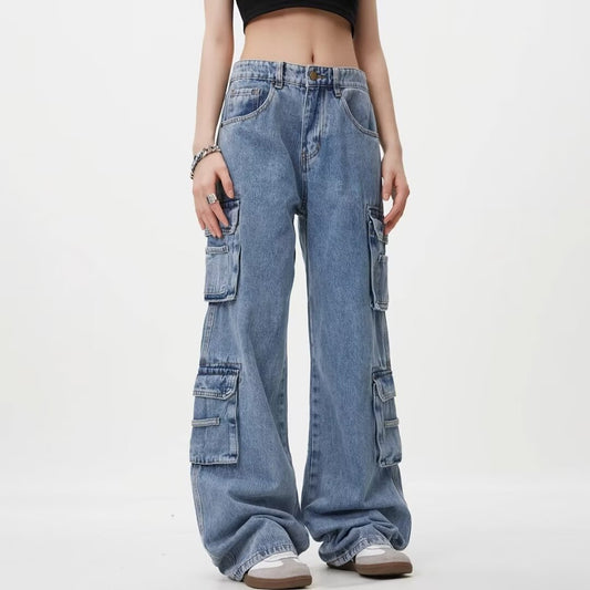 Person wearing high-waisted blue cargo jeans on a white background