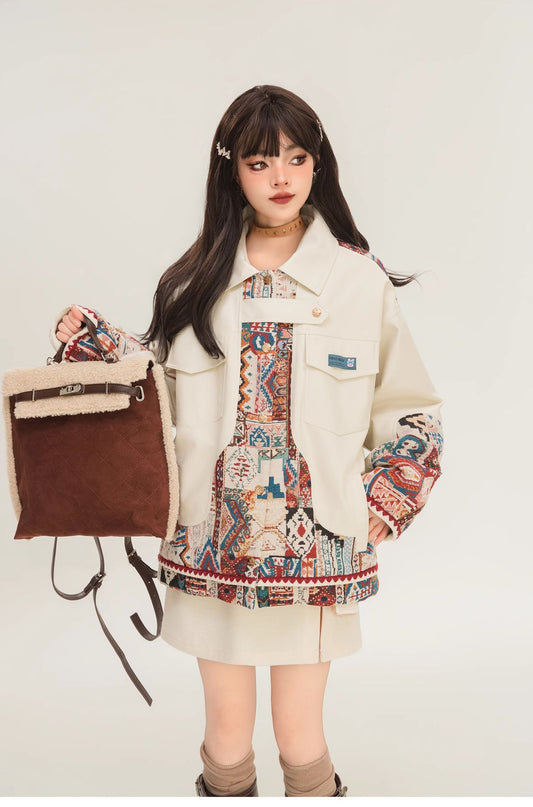 Woman wearing a patterned jacket with a backpack on a white background