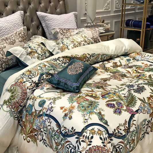Floral patterned bedding set on a bed with decorative pillows in a bedroom setting.