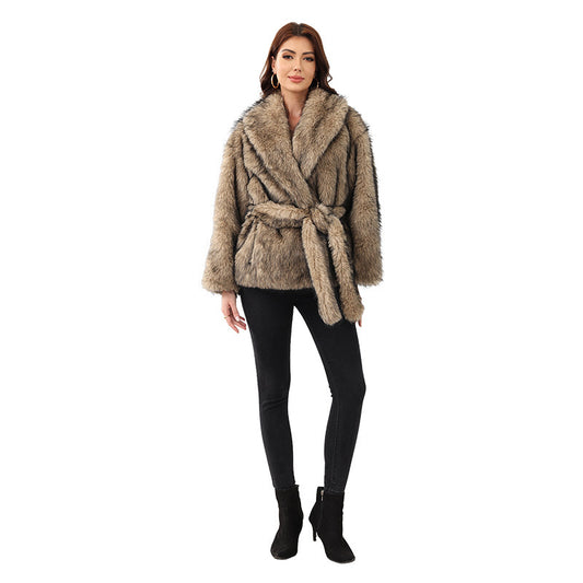 Woman wearing a brown faux fur coat on a white background