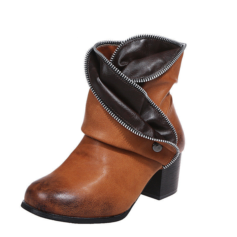 Brown leather boot with a zipper on a white background