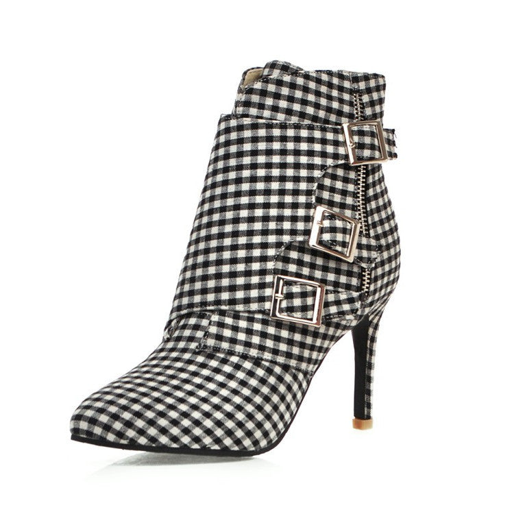 Black and white checkered boot with buckles on a white background