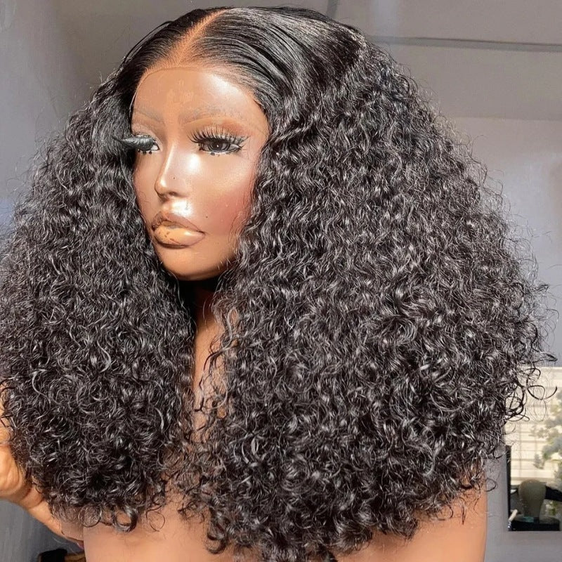 Mannequin head with a wig featuring curly hair on a neutral background