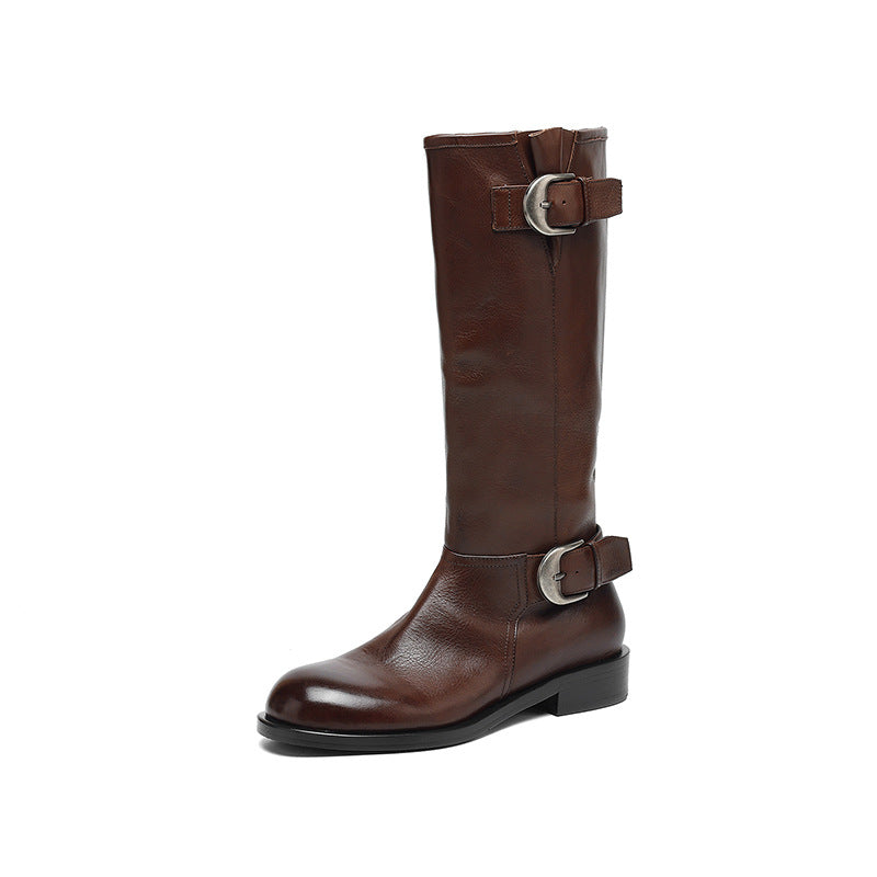 Brown leather boot with silver buckle on a white background