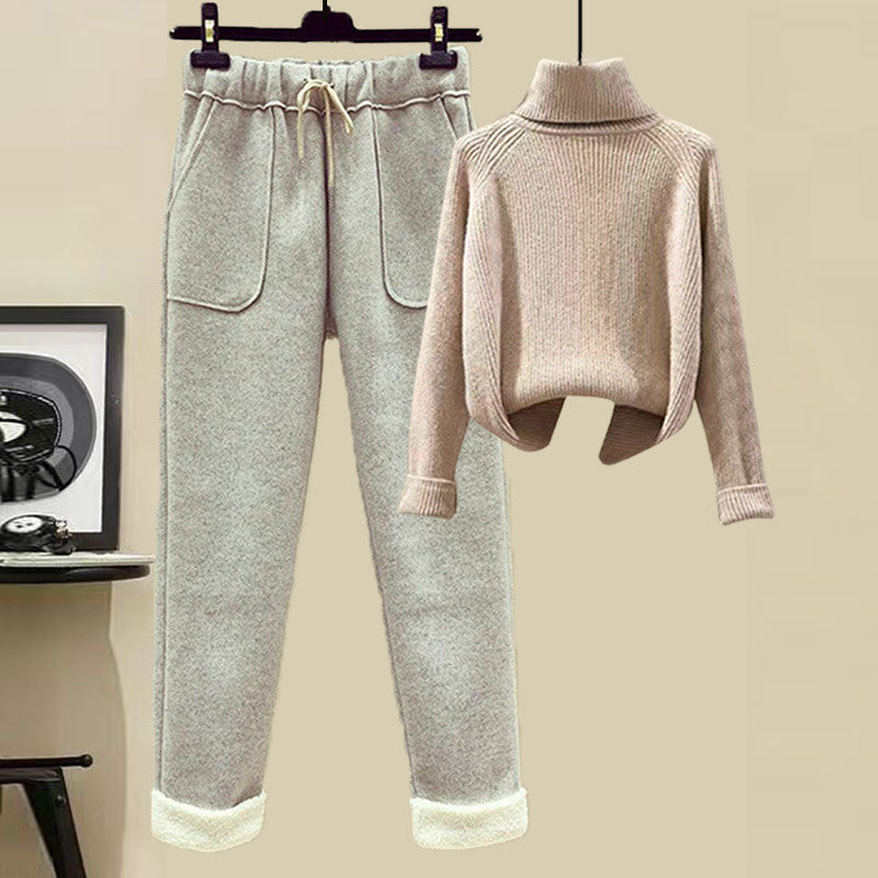 Light gray jogger pants and beige sweater on a beige background