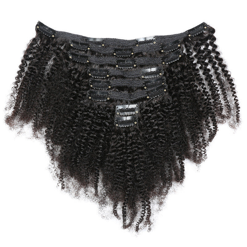Black curly hair extension with decorative elements on a white background