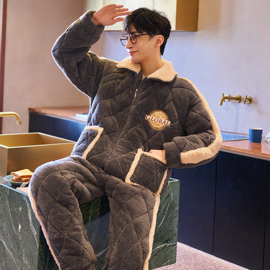 Person wearing a gray quilted pajama set with a 'Global' logo in a kitchen.