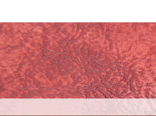 Close-up of a textured red surface with a white border