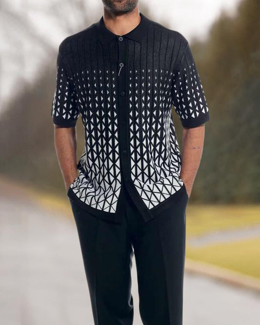 Person wearing a black and white patterned shirt with a blurred background