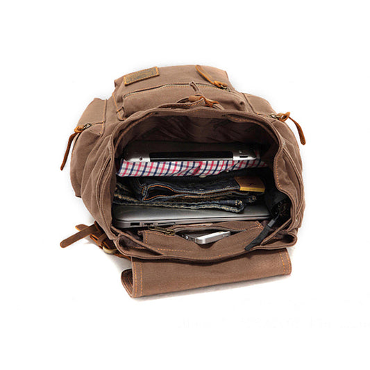 Brown backpack with items inside on a white background