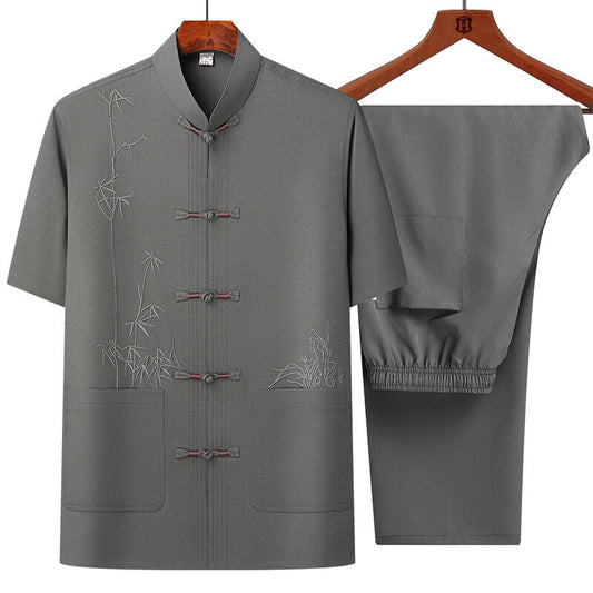 Gray traditional outfit with floral embroidery on a white background